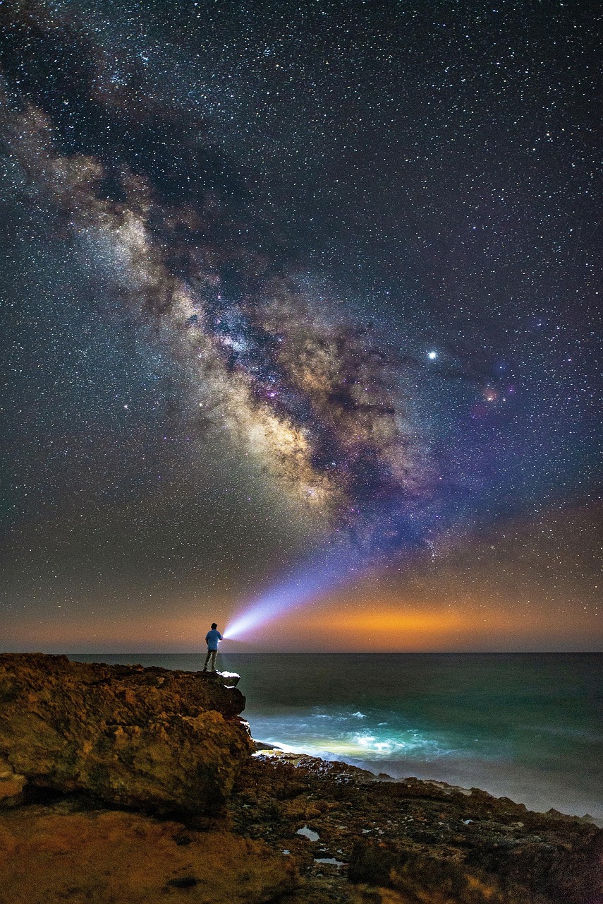 milky way, nature, human, starry sky, star, night sky, coast, atmosphere, sky, mystical, light, ray of light, lamp, flashlight